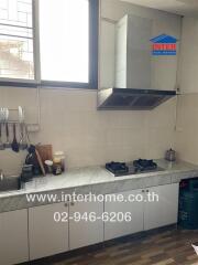 Modern kitchen with stove and sink