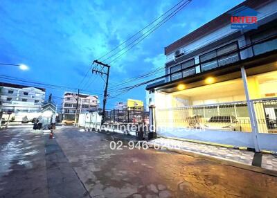 Street view of property building at dusk