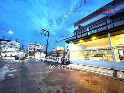 Street view of property building at dusk