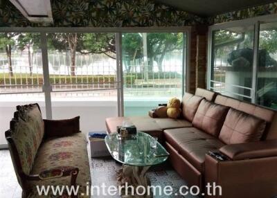 Cozy living room with glass windows and comfortable seating