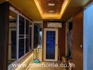 Long hallway with ceiling lights and construction materials