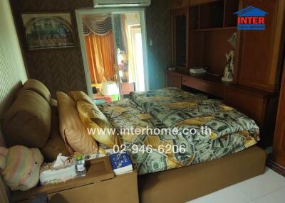 Cozy bedroom with double bed and decorative elements