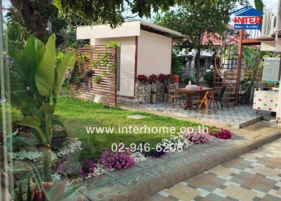 Beautiful garden area with outdoor seating and flowers