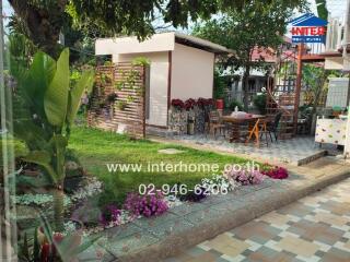 Beautiful garden area with outdoor seating and flowers