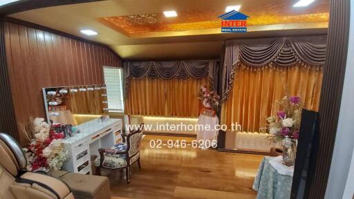 Living area with decorated curtains and wooden furnishings