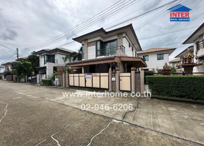 Modern residential house with driveway and front garden