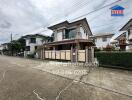 Modern residential house with driveway and front garden