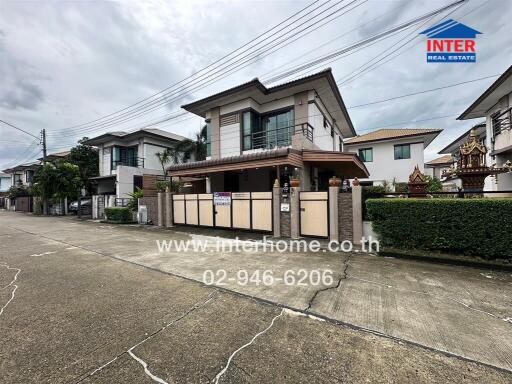 Modern residential house with driveway and front garden