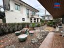 Outdoor seating area with decorative features and landscaping