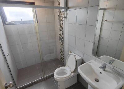 Modern bathroom with shower, toilet, and sink