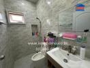 Bathroom with tiled walls and modern amenities