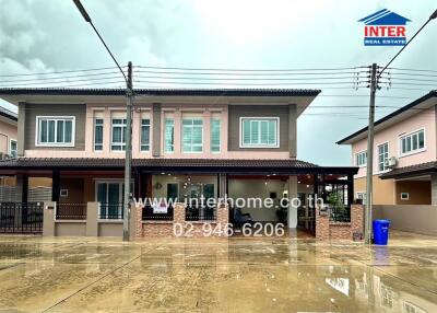 Two-story residential building with driveway