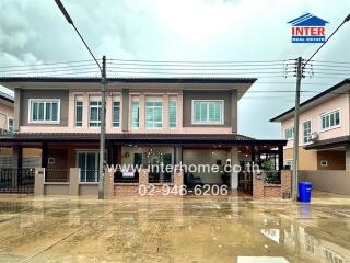 Two-story residential building with driveway