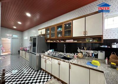 Modern kitchen with checkerboard flooring and ample storage