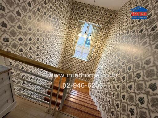 Stylish staircase with patterned wallpaper