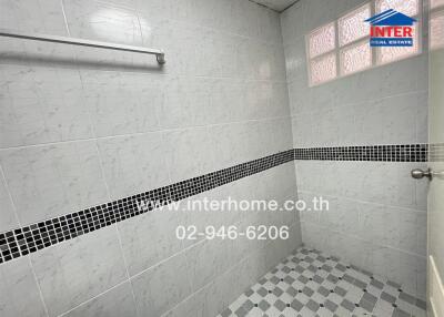 Bathroom with tiled walls and floor