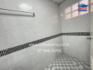 Bathroom with tiled walls and floor