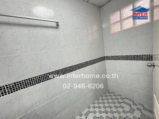 Bathroom with tiled walls and floor