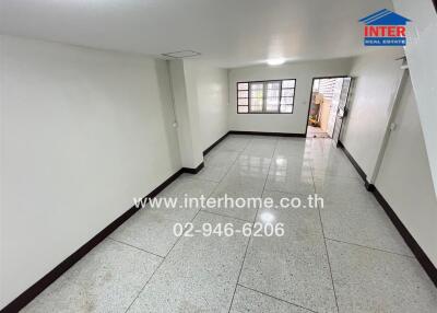 Empty room with tiled floor and window, potential living space