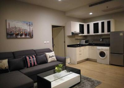 Modern living room with integrated kitchen