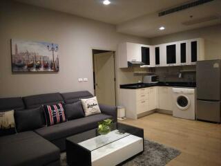 Modern living room with integrated kitchen