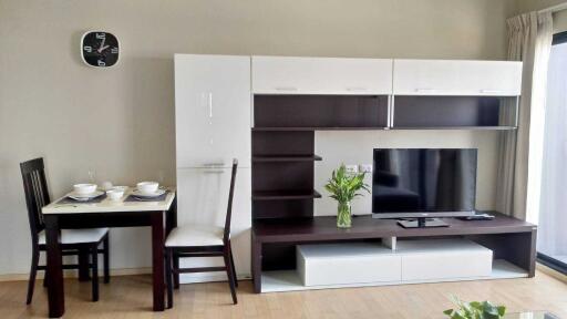 Modern living room with dining area and entertainment center