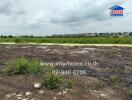 Vacant land with a view of houses in the distance