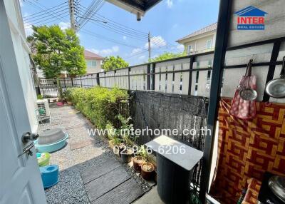 Outdoor space with garden and utility area