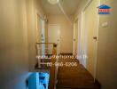 Hallway with wooden flooring and multiple doors