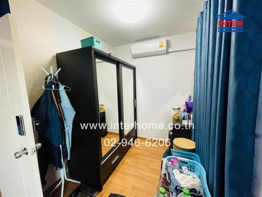 Small bedroom with wardrobe and air conditioning