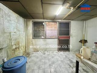 Kitchen with old style furnishing and tiled floor