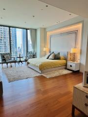 Modern bedroom with large windows and city view