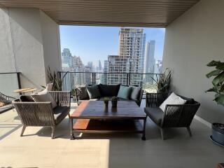 Modern balcony with city view and outdoor seating