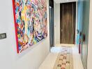 Modern hallway with colorful abstract painting and a runner rug