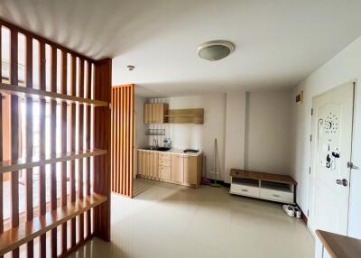 Minimalist kitchen with wooden furnishings and open layout