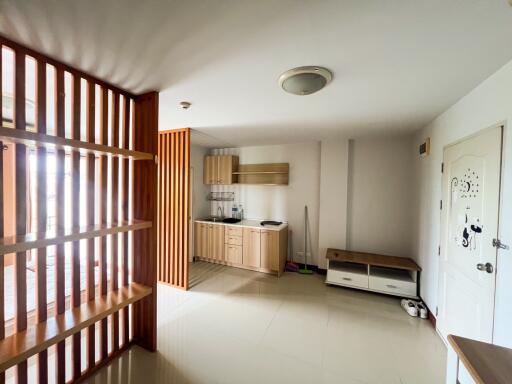 Minimalist kitchen with wooden furnishings and open layout