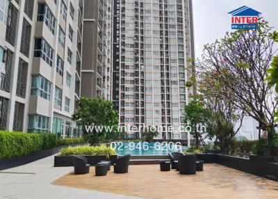 Outdoor view of a high-rise apartment building with a swimming pool and seating area