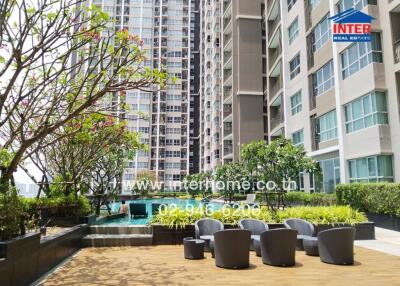 Outdoor communal area with seating at a high-rise building