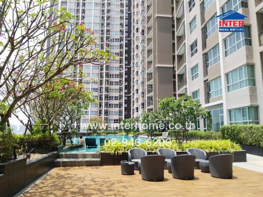 Outdoor communal area with seating at a high-rise building