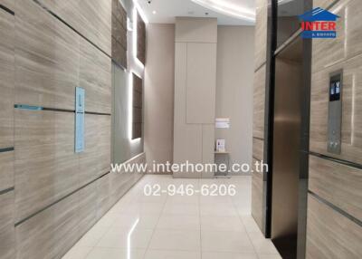 Building hallway with elevators and modern decor