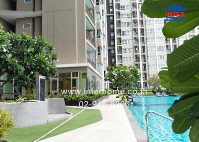 Outdoor view of apartment complex with pool