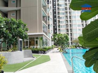 Outdoor view of apartment complex with pool