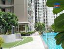 Outdoor view of apartment complex with pool