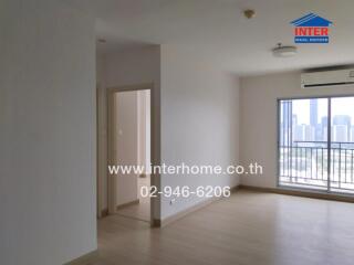 Spacious living room with natural light and balcony access