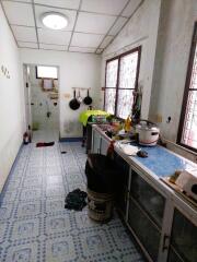 Kitchen with a view of the bathroom