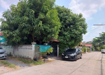 Front view of a house with a car parked in the driveway