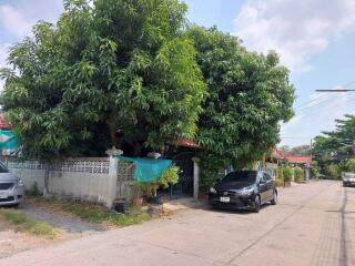 Front view of a house with a car parked in the driveway