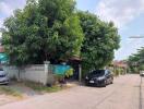 Front view of a house with a car parked in the driveway