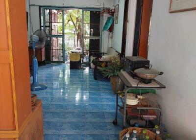 Corridor with household items and garden view