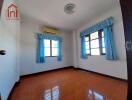 Bedroom with blue curtains and air conditioner